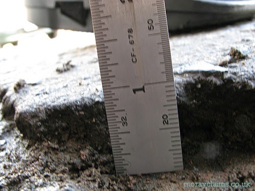 Close-up of the scale on a ruler used to show the height of a tripping hazard