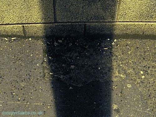 Shadow cast by Street Light Obscuring Pavement Defect which Caused Injury