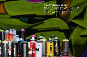 Cans of spray paint against a spray-painted background