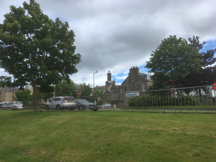 Grigor & Young's gable end at North Street, Elgin, viewed across the A96 at Alexandra Road